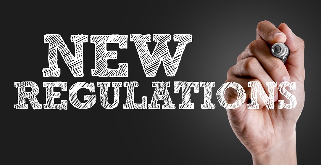 Hand writing the text: New Regulations New refrigerant coolant regulations writing